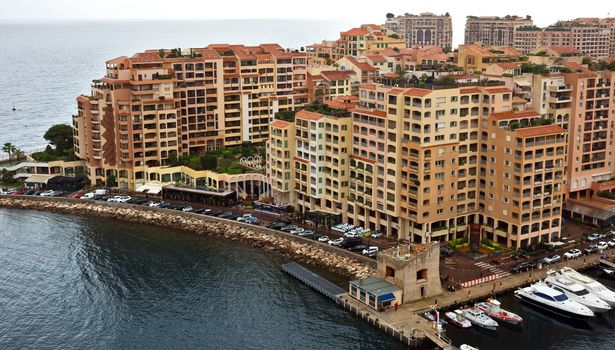 MONTE CARLO, MONACO - APRIL 28: Architecture Fontvieille district on April 28, 2013 in Monte Carlo, Monaco. Lands for the district have been reclaimed from the sea.

Monte Carlo, Monaco - April 28, 2013: Architecture Fontvieille district.  Lands for the district have been reclaimed from the sea.