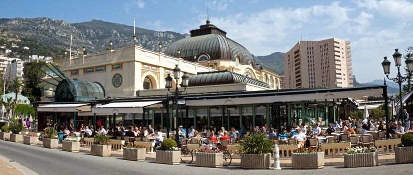 MONTE CARLO, MONACO - MAY 1: Famous Cafe de Paris on May 1, 2013 in Monte Carlo, Monaco. Cafe de Paris is one of the oldest and most stylish restaurants in Monte Carlo.

Monte Carlo, Monaco - May 1, 2013: Famous Cafe de Paris. Cafe de Paris is one of the oldest and most stylish restaurants in Monte Carlo. Tourists have dinner outside.