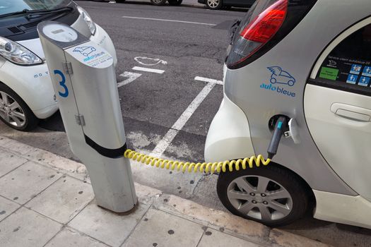 NICE - MAY 1: Electric cars at a charging station on May 1, 2013 in Nice, France.

Nice, France - May 1, 2013: Two electric cars charging on a street in the city of Nice.