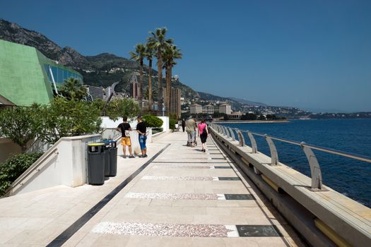 MONTE CARLO, MONACO - MAY 1: Larvotto Promenade on May 1, 2013 in Monte Carlo, Monaco. Larvotto is a part of the district of Monte Carlo in the Principality of Monaco.

Monte Carlo, Monaco - May 1, 2013: Larvotto Promenade. Larvotto is a part of the district of Monte Carlo in the Principality of Monaco. People walk along the waterfront.
