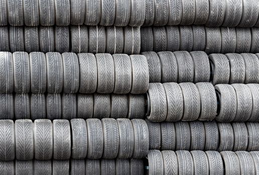 Stack of spare tires for racing, Monte Carlo, Monaco. 

MONTE CARLO, MONACO - MAY 1: Spare tires for racing The Monaco Grand Prix on May 1, 2013 in Monte Carlo, Monaco. Motor race held each year on the Circuit de Monaco. 