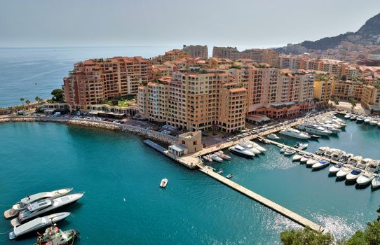 MONTE CARLO, MONACO - MAY 1: Architecture of Fontville district on May 1, 2013 in Monte Carlo, Monaco. Lands for the district have been reclaimed from the sea.

Monte Carlo, Monaco - May 1, 2013: Architecture of Fontville district.  Lands for the district have been reclaimed from the sea.