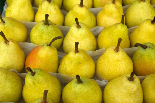 Yellow pears at a farmers market in France
