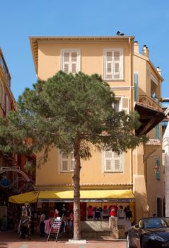 MONTE CARLO, MONACO - MAY 1: The architecture of buildings on May 1, 2013 in Monte Carlo, Monaco. 

Monte Carlo, Monaco - May 1, 2013: The architecture of buildings. People are shopping.