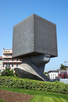 Seven storied building cube shaped as human head. It is the first monumental habitable sculpture in the world.

NICE, FRANCE - MAY 2: Square Head - building cube shaped as human head sculpture on May 2, 2013 in Nice, France. Authors are sculptor Sacha Sosno and architect Yves Bayard. Opened on June 29, 2002.

For Dreamstime:
Nice, France - December 06, 2005: Square Head - a seven storied building cube shaped as human head sculpture in Nice, France. Authors are sculptor Sacha Sosno and architect Yves Bayard. Opened on June 29, 2002, now Square Head houses the library administration.