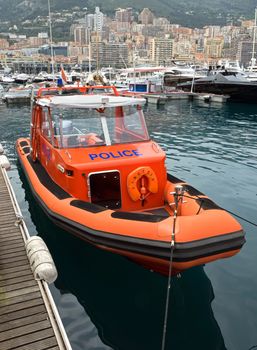 MONTE CARLO, MONACO - MAY 1: Police inflatable motorboat in the port on May 1, 2013 in Monte Carlo, Monaco. 

Monte Carlo, Monaco - May 1, 2013: Police inflatable motorboat in the port of Monaco.