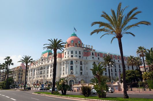 NICE, FRANCE - MAY 2: Luxury Hotel Negresco on May 2, 2013 in Nice, France. Hotel Negresco is the famous luxury hotel on the Promenade des Anglais in Nice, a symbol of the Cote d'Azur.

Nice, France - May 2, 2013: Luxury Hotel Negresco on English Promenade in Nice, French Riviera. Hotel Negresco is the famous luxury hotel on the Promenade des Anglais in Nice, a symbol of the Cote d'Azur