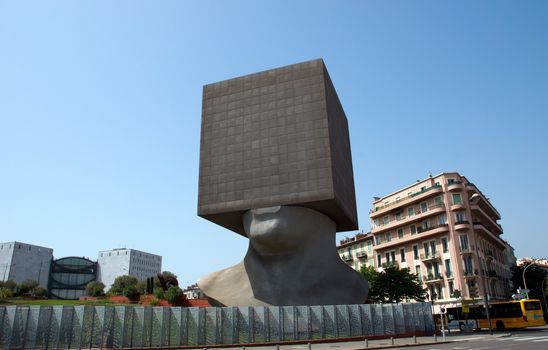 Seven storied building cube shaped as human head. It is the first monumental habitable sculpture in the world.

NICE, FRANCE - MAY 2: Square Head - building cube shaped as human head sculpture on May 2, 2013 in Nice, France. Authors are sculptor Sacha Sosno and architect Yves Bayard. Opened on June 29, 2002.

For Dreamstime:
Nice, France - December 06, 2005: Square Head - a seven storied building cube shaped as human head sculpture in Nice, France. Authors are sculptor Sacha Sosno and architect Yves Bayard. Opened on June 29, 2002, now Square Head houses the library administration.
