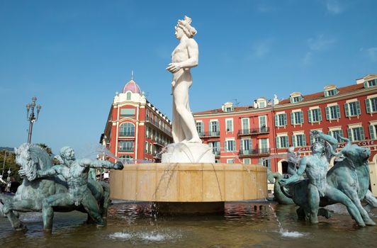 NICE, FRANCE - MAY 2:  Fountain Soleil on Place Massena on May 2, 2013 in Nice, France. The square was reconstructed in 1979.

Nice, France - May 2, 2013: Fountain Soleil on Place Massena. Square is located in the city center and is the most popular destination among tourists. The square was reconstructed in 1979. There are many boutiques, cafes and restaurants.