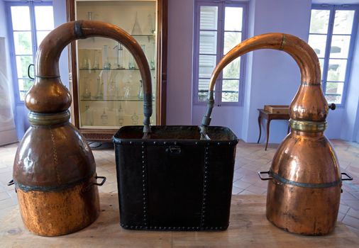 Ancient distiller for the production of perfume in Fragonard factory in Grasse, France