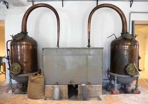 Ancient distiller for the production of perfume in Fragonard factory in Grasse, France