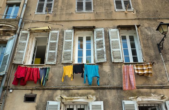 Old town in city of Grasse, France. Washing day.
