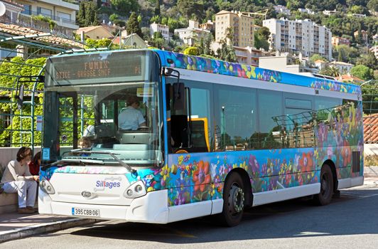 GRASSE, FRANCE - MAY 3: Passenger bus on a station on May 3, 2013 in Grasse, France. Coaches are very popular among tourists on the French Riviera.

Grasse, France - May 3, 2013: Passenger bus on a station. Coaches are very popular among tourists on the French Riviera.