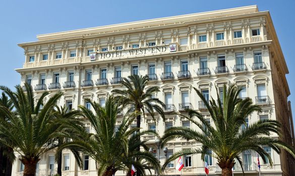 NICE, FRANCE - MAY 2: Architecture along Promenade des Anglais on May 2, 2013 in Nice, France. Promenade des Anglais is a symbol of the Cote d'Azur and was built in 1830 at the expense of the British colony.

Nice, France - May 2, 2013: Architecture along Promenade des Anglais. Promenade des Anglais is a symbol of the Cote d'Azur and was built in 1830 at the expense of the British colony.