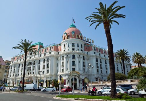 NICE, FRANCE - MAY 2: Luxury Hotel Negresco on May 2, 2013 in Nice, France. Hotel Negresco is the famous luxury hotel on the Promenade des Anglais in Nice, a symbol of the Cote d'Azur.

Nice, France - May 2, 2013: Luxury Hotel Negresco on English Promenade in Nice, French Riviera. Hotel Negresco is the famous luxury hotel on the Promenade des Anglais in Nice, a symbol of the Cote d'Azur. People are walking by street.