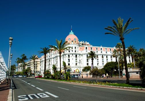 NICE, FRANCE - MAY 4: Luxury Hotel Negresco on May 4, 2013 in Nice, France. Hotel Negresco is the famous luxury hotel on the Promenade des Anglais in Nice, a symbol of the Cote d'Azur.

Nice, France - May 4, 2013: Luxury Hotel Negresco on English Promenade in Nice, French Riviera. Hotel Negresco is the famous luxury hotel on the Promenade des Anglais in Nice, a symbol of the Cote d'Azur