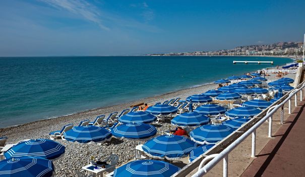 NICE, FRANCE - MAY 4: People on the beach Angel bay on May 4, 2013 in Nice, France. Citizens and tourists are sunbathing enjoying a sunny day on the beach.

Nice, France - May 4, 2013: People on the beach Angel bay. Citizens and tourists are sunbathing enjoying a sunny day on the beach in Angel bay.