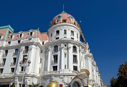 NICE, FRANCE - MAY 4: Luxury Hotel Negresco on May 4, 2013 in Nice, France. Hotel Negresco is the famous luxury hotel on the Promenade des Anglais in Nice, a symbol of the Cote d'Azur.

Nice, France - May 4, 2013: Luxury Hotel Negresco on English Promenade in Nice, French Riviera. Hotel Negresco is the famous luxury hotel on the Promenade des Anglais in Nice, a symbol of the Cote d'Azur.