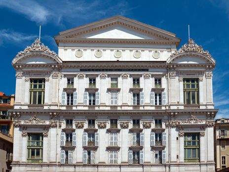 NICE, FRANCE - MAY 4: Opera de Nice located at the Promenade des Anglais on May 4, 2013 in Nice, France. It was built in 1776 by Marquess Alli-Maccarani.

Nice, France - May 4, 2013: Front facade of the Opera house. Opera de Nice located at the Promenade des Anglais. It was built in 1776 by Marquess Alli-Maccarani. Sold in 1787, it reopened in 1790 under the name “Theatre Royal”. Now Opera de Nice offers three types of performances: operas, ballets and classical concerts ; and houses the Ballet Nice Méditerrannée and the Nice Philharmonic Orchestra.
