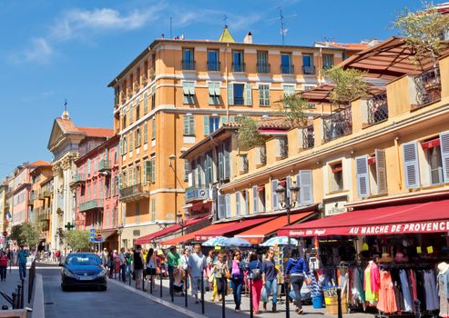 NICE, FRANCE - MAY 4: Architecture of city of Nice in the southern France on May 4, 2013 in Nice, France. Nice is a symbol of Provence Alpes Cote d'Azur.

Nice, France - May 4, 2013: Architecture of city of Nice in the southern France. Nice is a symbol of Provence Alpes Cote d'Azur. People are walking by street.