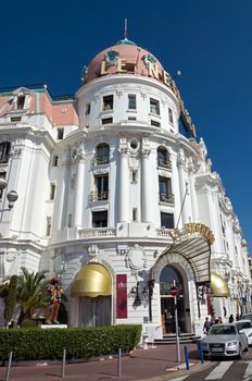 NICE, FRANCE - MAY 4: Luxury Hotel Negresco on May 4, 2013 in Nice, France. Hotel Negresco is the famous luxury hotel on the Promenade des Anglais in Nice, a symbol of the Cote d'Azur.

Nice, France - May 4, 2013: Luxury Hotel Negresco on English Promenade in Nice, French Riviera. Hotel Negresco is the famous luxury hotel on the Promenade des Anglais in Nice, a symbol of the Cote d'Azur. People go near the hotel.