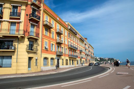 NICE, FRANCE - MAY 4: The architecture along the Promenade des Anglais on May 4, 2013 in Nice, France. Promenade des Anglais is the most popular place for walking among citizens and tourists.

Nice, France - May 4, 2013: The architecture along the Promenade des Anglais. Citizens and tourists walking along the waterfront.
Promenade des Anglais is the most popular place for walking among citizens and tourists.
