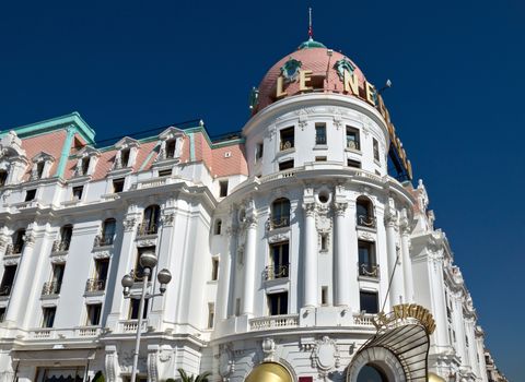 NICE, FRANCE - MAY 4: Luxury Hotel Negresco on May 4, 2013 in Nice, France. Hotel Negresco is the famous luxury hotel on the Promenade des Anglais in Nice, a symbol of the Cote d'Azur.

Nice, France - May 4, 2013: Luxury Hotel Negresco on English Promenade in Nice, French Riviera. Hotel Negresco is the famous luxury hotel on the Promenade des Anglais in Nice, a symbol of the Cote d'Azur.