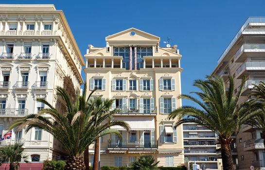 NICE, FRANCE - MAY 4: Architecture along Promenade des Anglais on May, 4, 2013 in Nice, France. It is a symbol of the Cote d'Azur and was built in 1830 at the expense of the British colony.

Nice, France - May 4, 2013: Architecture along Promenade des Anglais. People are walking. Promenade des Anglais is a symbol of the Cote d'Azur and was built in 1830 at the expense of the British colony.