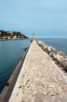 Lighthouse tower at port entrance in Nice