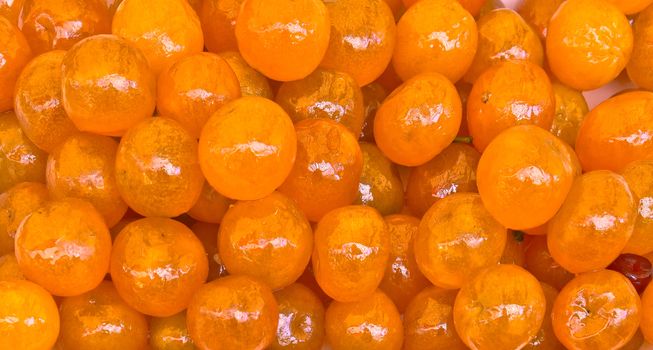 Orange candy made like fruit. Market in city of Nice, France.