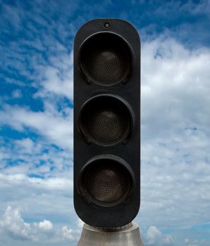 Black traffic lights against blue sky backgrounds. Clipping Path included.