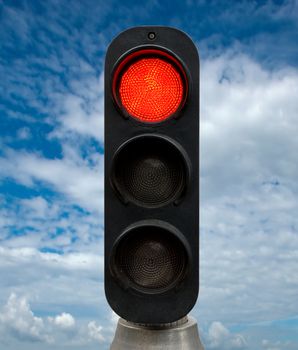 Red traffic lights against blue sky backgrounds. Clipping Path included.