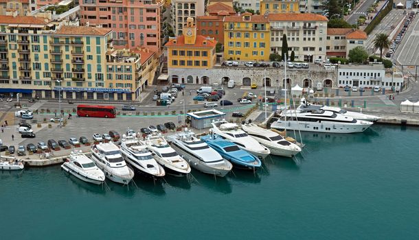 NICE, FRANCE - MAY 5: Aerial view of the Port de Nice on May 5, 2013 in Nice, France. Port de Nice was started in 1745.

Nice, France - May 5, 2013: Aerial view of the Port de Nice in French Riviera. Port de Nice was started in 1745.