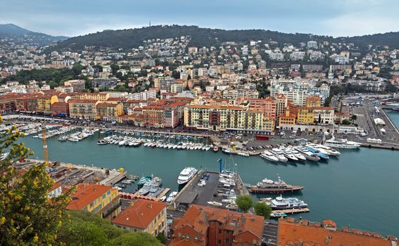 NICE, FRANCE - MAY 5: Aerial view of the Port de Nice on May 5, 2013 in Nice, France. Port de Nice was started in 1745.

Nice, France - May 5, 2013: Aerial view of the Port de Nice in French Riviera. Port de Nice was started in 1745.