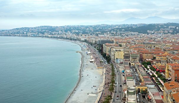 NICE, FRANCE - MAY 5: Promenade des Anglais from above on May 5, 2013 in Nice, France. It is a symbol of the Cote d'Azur and was built in 1830 at the expense of the British colony.

Nice, France - May 05, 2013: Promenade des Anglais from above. Promenade des Anglais is a symbol of the Cote d'Azur and was built in 1830 at the expense of the British colony. People are walking along promenade.