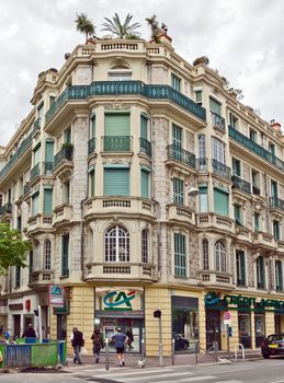 NICE, FRANCE - MAY 5: Architecture along Promenade des Anglais on May, 5, 2013 in Nice, France. It is a symbol of the Cote d'Azur and was built in 1830 at the expense of the British colony.

Nice, France - May 5, 2013: Architecture along Promenade des Anglais. Promenade des Anglais is a symbol of the Cote d'Azur and was built in 1830 at the expense of the British colony. People are walking by street.