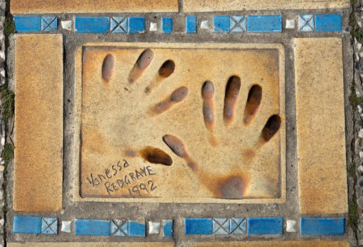 CANNES, FRANCE - MAY 6: Autograph and hand print of Vanessa Redgrave on a clay tile near Film Festival Palace on May 6, 2013 in Cannes, France.