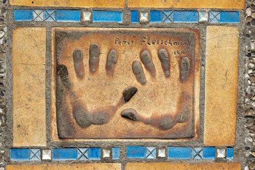 CANNES, FRANCE - MAY 6: Hand print of Peter Fleischmann on a clay tile near Film Festival Palace on May 6, 2013 in Cannes, France.