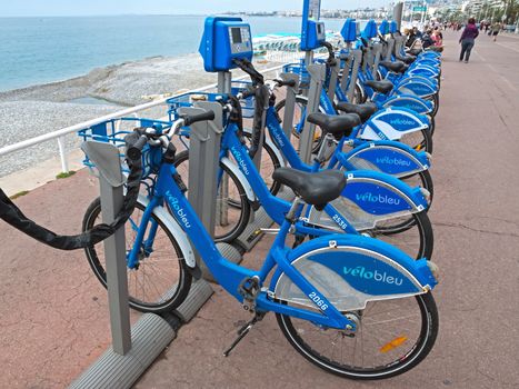 NICE, FRANCE - MAY 5: Public Bicycles Sharing Station on Promenade Des Anglais on May 5, 2013 in Nice, France. One of 120 stations in Nice. This service offers over 1200 self-service bicycles.

Nice, France - May 5, 2013: Public Bicycles Sharing Station on Promenade Des Anglais. One of 120 stations in Nice. This service offers over 1200 self-service bicycles.