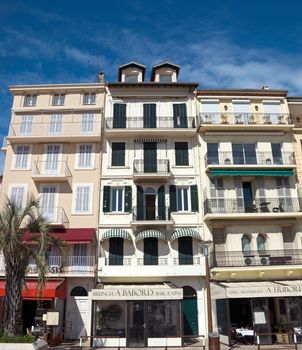 CANNES, FRANCE - MAY 6: Architecture of Cannes along the Croisette on May 6, 2013 in Cannes, France. City founded by the Romans in 42 BC.

Cannes, France - May 6, 2013: Architecture of Cannes along the Croisette. Cannes is a city located in the French Riviera. The city is also famous for its luxury shops, restaurants, and hotels. City founded by the Romans in 42 BC.