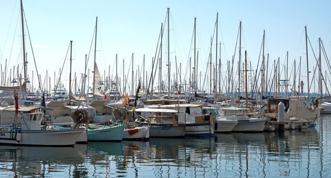 CANNES, FRANCE - MAY 6: Boats moored in the port on May 6, 2013 in Cannes, France.

Cannes, France - May 6, 2013: Boats moored in the port of Cannes.