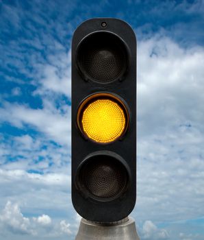 Yellow traffic lights against blue sky backgrounds. Clipping Path included.