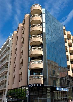 CANNES, FRANCE - MAY 6: Architecture of Cannes along the Croisette on May 6, 2013 in Cannes, France. City founded by the Romans in 42 BC.

Cannes, France - May 6, 2013: Architecture of Cannes along the Croisette. Cannes is a city located in the French Riviera. The city is also famous for its luxury shops, restaurants, and hotels. City founded by the Romans in 42 BC.