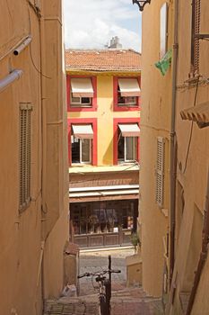 CANNES, FRANCE - MAY 6: Old district in historical centre on May 6, 2013 in Cannes, France. City founded by the Romans in 42 BC.

Cannes, France - May 6, 2013: Old district in historical centre of Cannes, France. Cannes is a city located in the French Riviera. The city is also famous for its luxury shops, restaurants, and hotels. City founded by the Romans in 42 BC. 