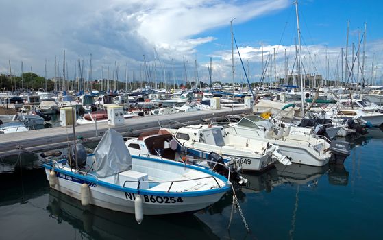 ANTIBES, FRANCE - MAY 6: Anchored boats in Port Grimaldi on May 6, 2013 in Antibes, France.

Antibes, France - May 6, 2013: Anchored boats in Port Grimaldi on the French Riviera.