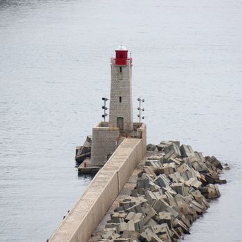 Lighthouse tower at port entrance in Nice