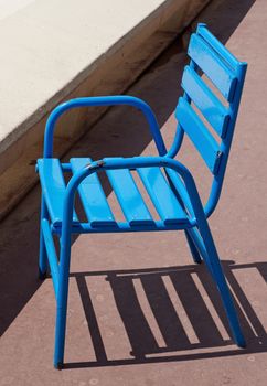 The famous blue chairs on the Croisette promenade in Cannes, France.