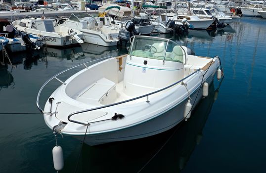 ANTIBES, FRANCE - MAY 6: Anchored boat in Port Grimaldi on May 6, 2013 in Antibes, France.

Antibes, France - May 6, 2013: Anchored boat in Port Grimaldi on the French Riviera.