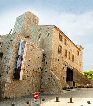 ANTIBES, FRANCE - MAY 6: Grimaldi Castle on May 6, 2013 in Antibes, France. Grimaldi Castle now is the Picasso Museum, where are exposed paintings and ceramics of Pablo Picasso. 

Antibes, France - May 6, 2013: Grimaldi Castle. Grimaldi Castle now is the Picasso Museum, where are exposed paintings and ceramics of Pablo Picasso.