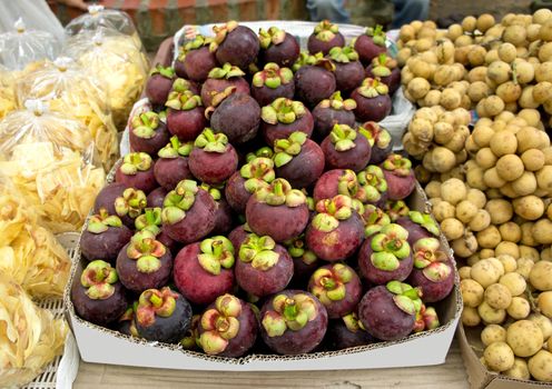 A lot of mangosteens in the market of Thailand